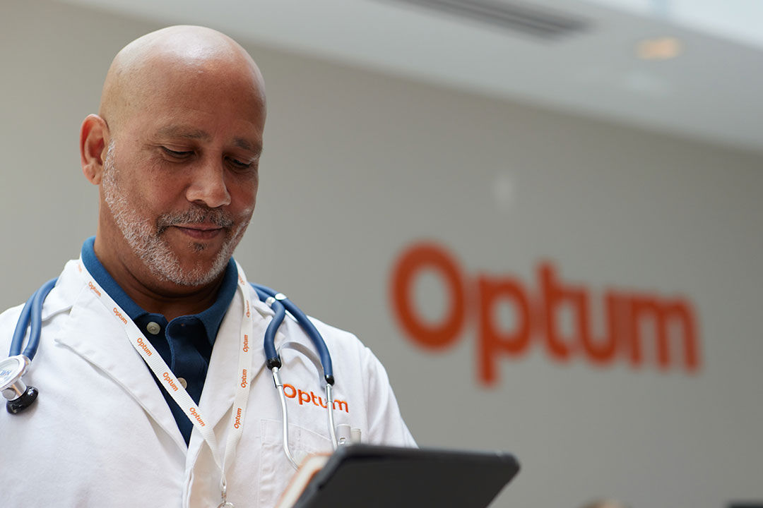 Optum clinician looking at a tablet