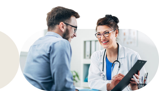 Healthcare provider reviewing care plan information with a patient using a tablet. 